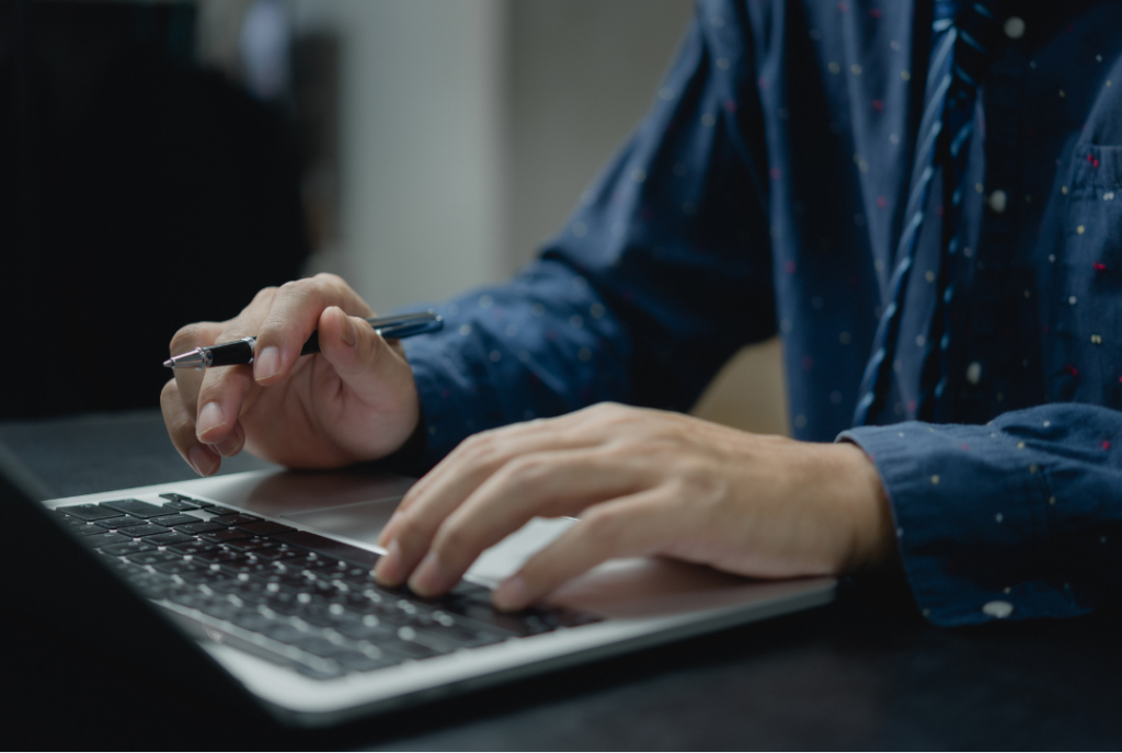 Man on laptop, technology project planning,